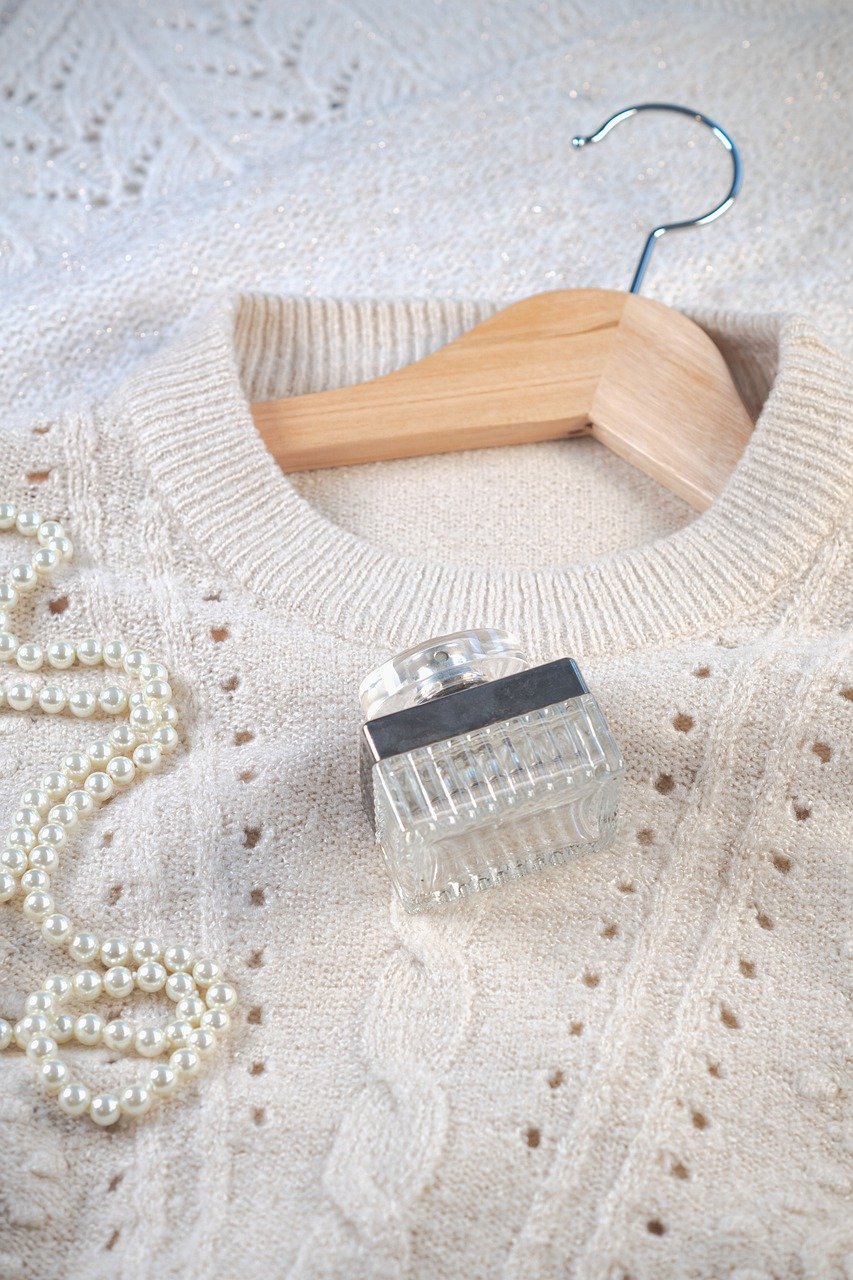 sweater, pearls, perfume