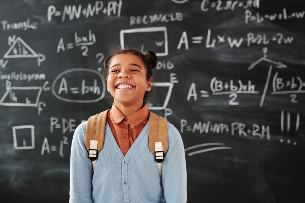 Smiling Girl Carrying a Backpack